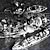 USS Massachusetts with Tug Boats